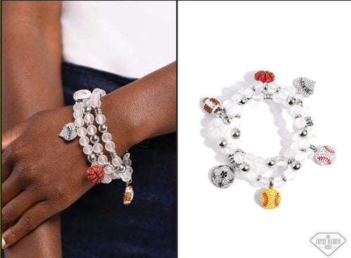 Monica’s Empire Diamond Design is a unique mix of sentimental charm and pure jewelry joy. Two strands of glassy, white beads and sporadic silver accents are threaded along stretchy bands with a variety of sports-themed charms emblazoned with rhinestones. The charms shimmer playfully with every flick of the wrist, which means plenty of sparkle on the sidelines this season!