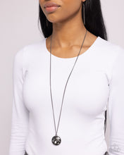 Load image into Gallery viewer, n oversized smoky gem swings from the bottom of a lengthened gunmetal chain for a dramatic look. Features an adjustable clasp closure.
