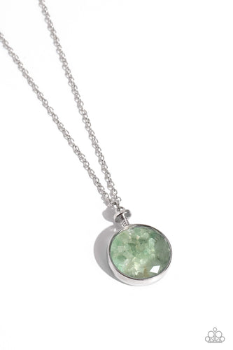 Pieces of jade stones shift back and forth inside a glassy frame encased in a silver compass-like fitting, resulting in a dramatically earthy pendant at the bottom of an extended silver chain. Features an adjustable clasp closure. 