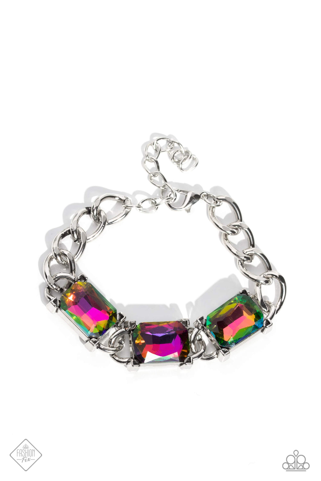 A trio of gleaming, radiant-cut, oil spill gems encased in thick silver frames, wraps boldly around the wrist on a thick silver curb chain for an edgy statement. Features an adjustable clasp closure. Due to its prismatic palette, color may vary.  Sold as one individual bracelet  New Kit Fashion Fix