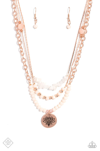 Shimmery strands of rose gold layer across the chest, emitting a cozy glow. The top strand features a collection of white stones, which lays above a row of faceted light pink beads alternating with shimmery rose gold accents. The lowermost strand is lined with faceted pink beads in varying opacities, from which a rose gold disc engraved with a lotus flower emerges. As the stone elements in this piece are natural, some color variation is normal.