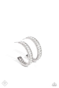 A row of dainty white pearls seemingly floats between rhinestone-encrusted bands of silver, as they curl around the ear to create an elegant hoop. Earring attaches to a standard post fitting. Hoop measures approximately 1 1/2" in diameter.  Sold as one pair of hoop earrings.