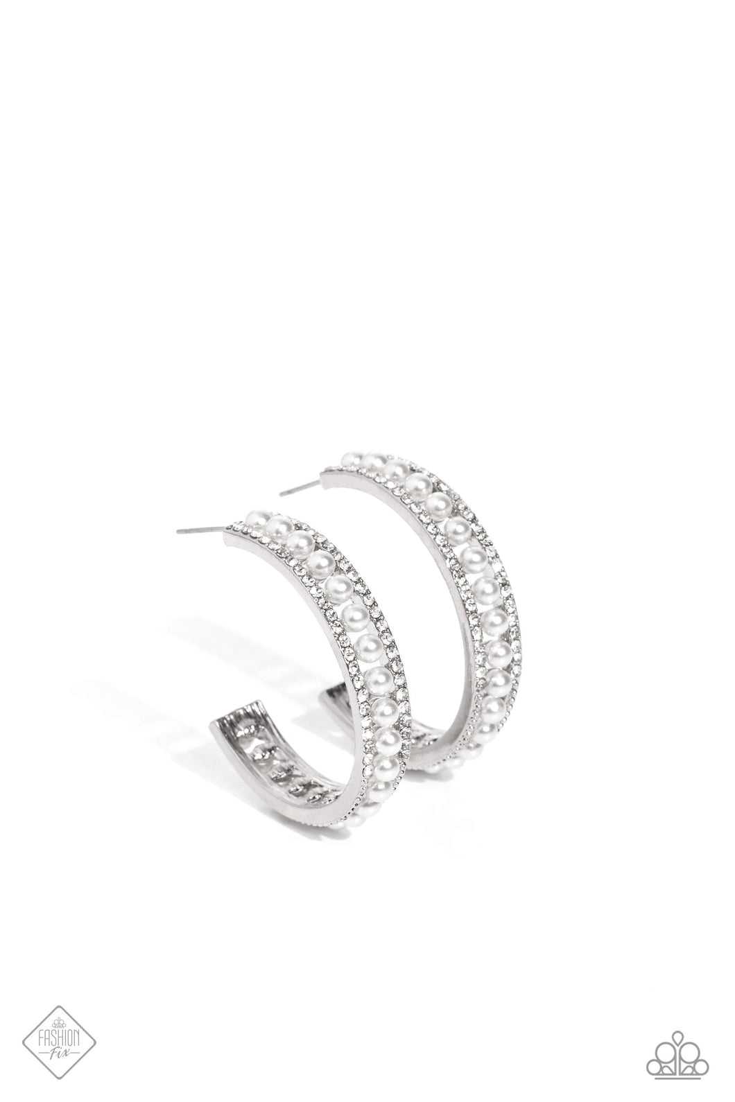 A row of dainty white pearls seemingly floats between rhinestone-encrusted bands of silver, as they curl around the ear to create an elegant hoop. Earring attaches to a standard post fitting. Hoop measures approximately 1 1/2