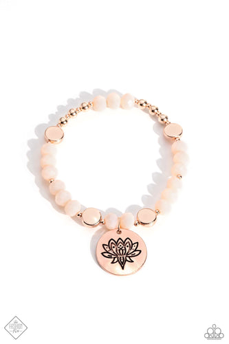 An exaggerated rose gold pendant stamped with a lotus flower motif dangles from the wrist, creating a transcendent design. Vanilla Cream beads and rose gold discs, beads, and accents fan out from the pendant, stretching along the wrist on an elastic band and finishing the design off with a calming collection of class.  Sold as one individual bracelet.