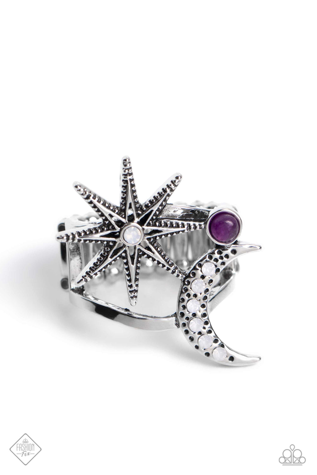 Featuring opalescent rhinestones and a border of tiny silver studs, a three-dimensional silver star and moon sit atop an airy silver band for a stellar look. A dainty amethyst stone dots between the two cosmic charms for a pop of earthy color. Features a stretchy band for a flexible fit.  Sold as one individual ring.