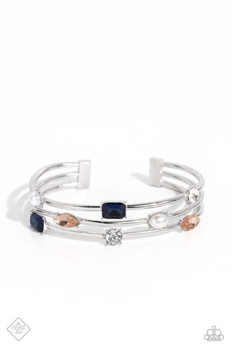 Sleek silver bars arc across the wrist, creating an airy cuff. Polished white pearls, and sparkling rhinestones in blue, peach, and classic white finishes are encased in pronged fittings and sporadically sprinkled along the metallic framework, infusing the design with vintage refinement.  Sold as one individual bracelet.