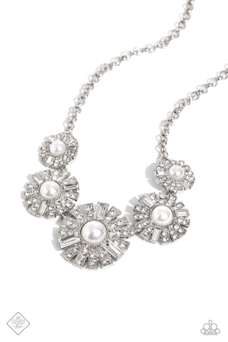 Sleek metal bars flare out from a mesmerizing pearl center, creating a stacked rhinestone-encrusted fringe of fanning frames. A trio of emerald-cut white gem bars are sprinkled across each dazzling display for a classy finish. Features an adjustable clasp closure.   Featured inside The Preview at Made for More! Sold as one individual necklace. Includes one pair of matching earrings.