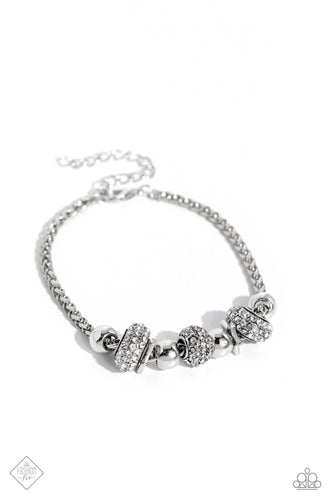 Round and cylindrical shimmery silver beads, infused with sparkling white rhinestones, slide along a thick silver chain, while glistening silver star silhouettes - also embossed on the rhinestone-encrusted beads in a daintier size - create a star-struck finish around the wrist. Features an adjustable clasp closure.  Sold as one individual bracelet.