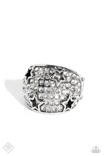 Row after row of incandescent white rhinestones stack into a dazzling display across a beveled silver band. Silver star silhouettes haphazardly dot across the dazzling surface, creating a commanding statement piece. Features a stretchy band for a flexible fit.  Sold as one individual ring.