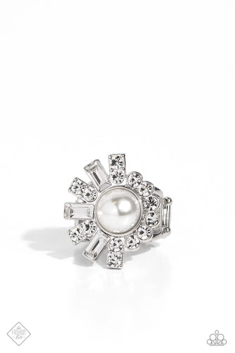 A curved row of white rhinestones collide with flared bars of silver that lay on the opposite side and form into a sunburst shape atop airy silver bands. The flared bars alternate between stacked white rhinestones and emerald-cut white gem bars, offsetting the pearly sheen of the center of the ring, creating an abstract blend of dazzle and glitz. Features a stretchy band for a flexible fit.