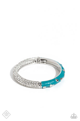 Four dainty rows of white rhinestones are encrusted across one side of a silver cuff-like bangle for a timeless fashion. Featuring a silver heart motif, the other side of the silver cuff is painted in a vibrant shade of turquoise for a carefree finish. Features a hinged closure.