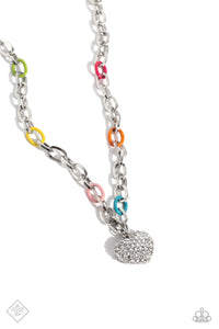 Painted in a colorful finish, solitaire multicolored paperclip links connect to a shiny silver paperclip link chain for a vivacious pop of color below the collar. A white rhinestone-encrusted thick heart pendant dangles from the bottom of the design for a sparkly finish. Features an adjustable clasp closure.