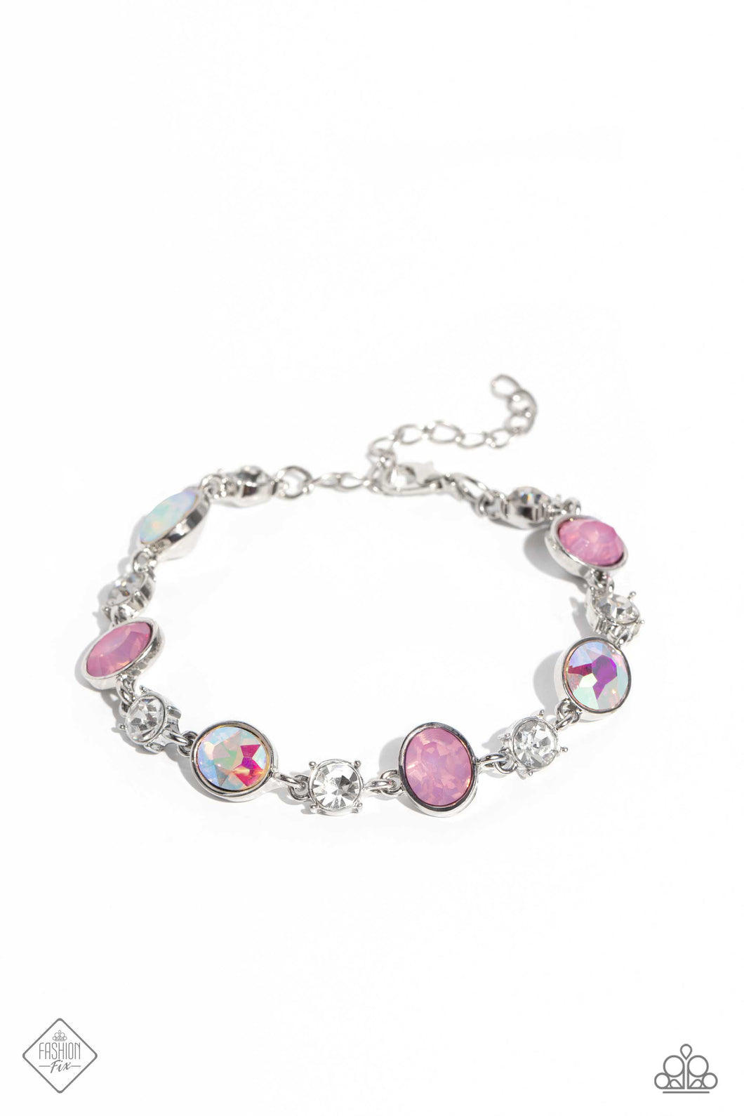 Featuring pronged silver fittings, white solitaire rhinestones alternate with oval opalescent pink and iridescent gems, linking around the wrist for a timeless, dreamy finish. Features an adjustable clasp closure. Due to its prismatic palette, color may vary.  Sold as on