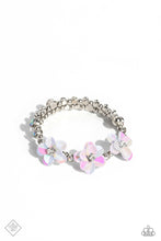 Load image into Gallery viewer, Shiny silver beads, white rhinestones in sleek silver frames, and varying sizes of iridescent gems in the same silver frames are threaded along a wire that coils around the wrist to create an infinity wrap style bracelet. At the center of the design, a trio of white iridescent flowers with white rhinestone centers emerges, adding a touch of whimsical color and three-dimensional texture. Due to its prismatic palette, color may vary.  Sold as one individual bracelet.
