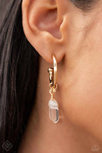 Load image into Gallery viewer, A small, skinny, gold hoop curves around the ear in a timeless fashion. A gold ball is affixed to the end of the hoop, reminiscent of a barbell fitting. Delicately attached to gold wire, a chiseled piece of clear white stone slides along the curvature of the hoop, adding a surprising hint of stony movement. Earring attaches to a standard post fitting. Hoop measures approximately 3/4&quot; in diameter. As the stone elements in this piece are natural, some color variation is normal.
