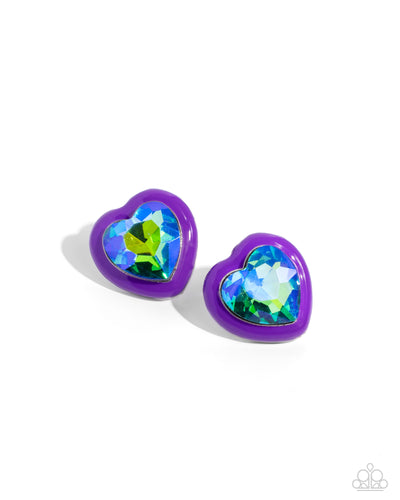 Pressed in a border of purple paint, an oversized UV shimmery heart gem glimmers from the ear, resulting in a romantic-inspired display. Earring attaches to a standard post fitting.