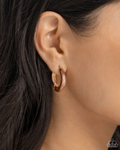 Load image into Gallery viewer, Featuring an oblong-cut, an abstract rose gold hoop hugs the ear for a sleek, monochromatic design. Earring attaches to a standard hinge closure fitting. Hoop measures approximately 1&quot; in diameter.
