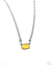 Load image into Gallery viewer, Featuring a defaced finish, a yellow cat&#39;s eye bead is pressed in a silver-pronged fitting that cascades from a glistening white rhinestone chain for a delicate, dazzling design. Features an adjustable clasp closure. 
