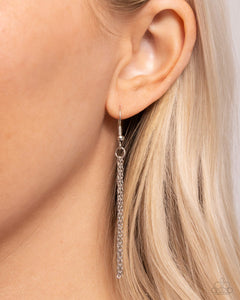 Elongated strands of ball-and-bar chains combine with dainty classic silver chains for an industrial, dynamic display. Features an adjustable clasp closure.