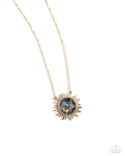 Gliding along a dainty gold chain, a gold sunburst pendant, embellished with gold foil against a navy backdrop creates a stunning sunny statement. Features an adjustable clasp closure. 