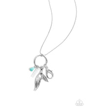 Load image into Gallery viewer, Accented with a cat&#39;s eye green teardrop, an oversized silver mermaid tail with lines of dainty white rhinestones, and a rectangular white shell, a silver ring is attached at the bottom of a lengthened silver chain for a mystically magical display. A lobster clasp hangs from the bottom of the design to allow a name badge or other item to be attached. Features an adjustable clasp closure. 
