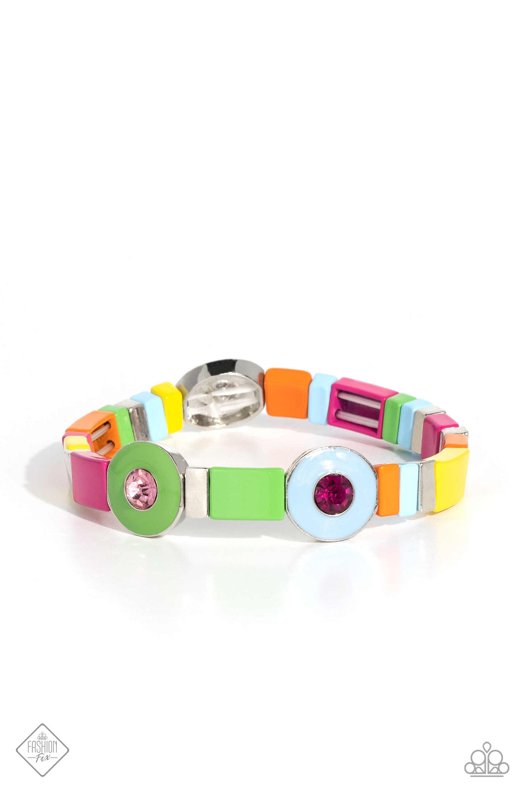 Alternating along the wrist in a whimsically colorful pattern, a collection of stacked silver cube beads, and multicolored metallic squares are threaded along an elastic stretchy band. Three circular frames, in Pantone® shades of Classic Green, Summer Song, and Fuchsia Fedora, haphazardly interrupt the cubed beading, showcasing their colorful rhinestone centers for additional contrast around the wrist.  Sold as one individual bracelet.  New Kit Fashion Fix