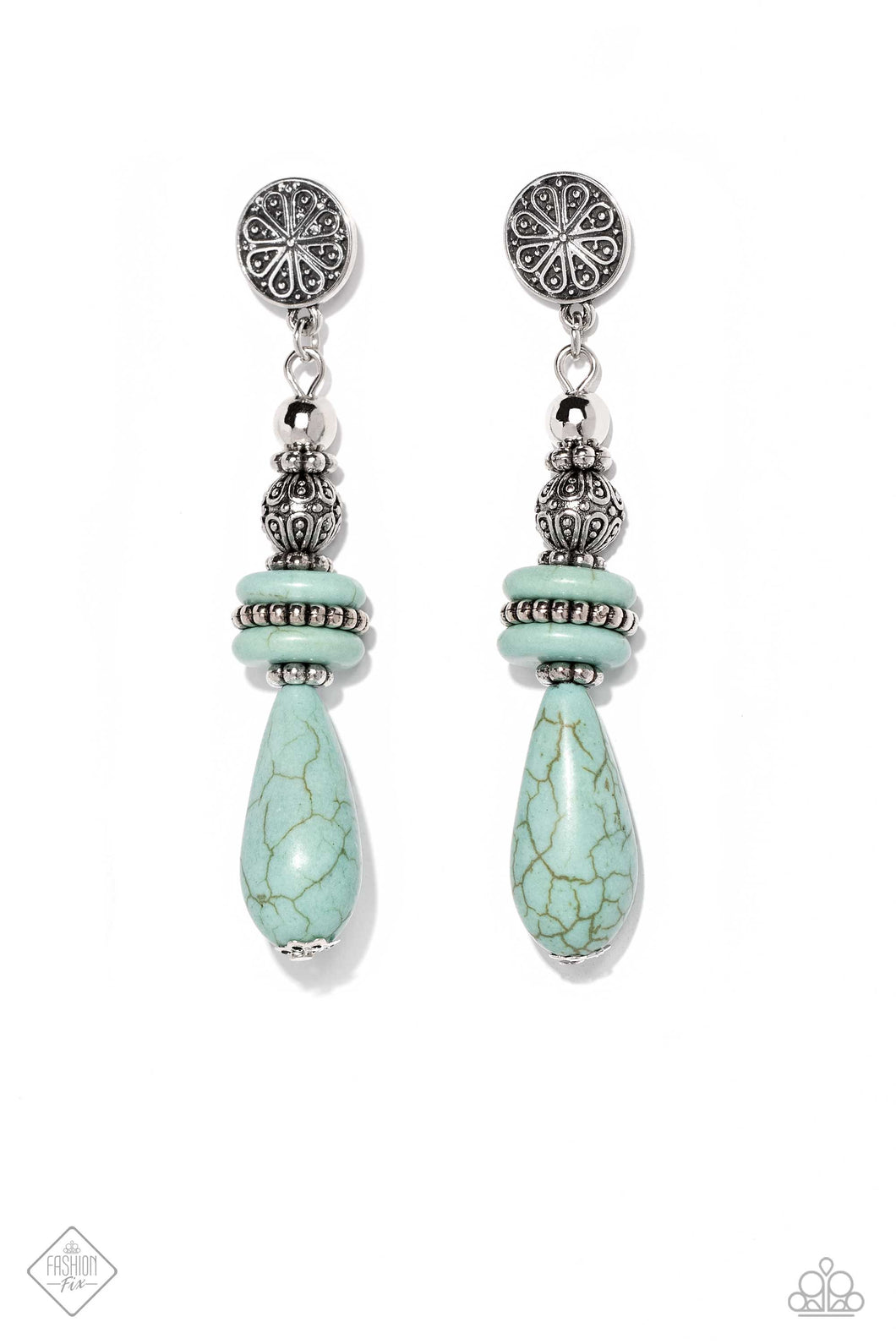 A silver disc, embossed in floral detail, anchors a cascade of intricately textured silver beads and muted turquoise stones. Artfully stacked in symmetrical precision, the silver beading gives way to an elongated light turquoise teardrop, which sways in pendulous perfection. Earring attaches to a standard post fitting. As the stone elements in this piece are natural, some color variation is normal.  Sold as one pair of post earrings.  New Kit Fashion Fix