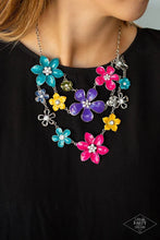 Load image into Gallery viewer, Painted in vivacious shades of blue, pink, purple, and yellow, a collection of colorful and plain silver floral-shaped frames bloom below the collar in three vivacious rows. Dainty white rhinestones dot the center of each flower, for a shimmery finish. Features an adjustable clasp closure.    Life of The Party with Empire Diamond Access brought back by Mandi H.
