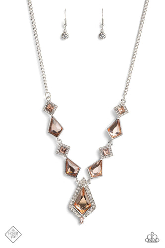 Glassy peach gems are chiseled into square cuts and kite shapes, creating dramatic angles as they link along a silver chain. Tiny white rhinestones create glitzy borders around the square-cut gems that are tilted on their sides, alternating with the sleek silver frames that encase the kite-shaped gems. 