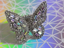 Load image into Gallery viewer, Paparazzi Jewelry Flauntable Flutter Multi Ring - Gunmetal Oil Spill Butterfly  Dainty oil spill emerald style rhinestones are sprinkled across the wings of a silver butterfly that is encrusted in glassy hematite rhinestones for a dramatically dazzling finish. Features a stretchy band for a flexible fit.
