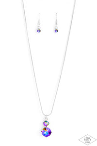 Nestled inside classic silver prongs, two oversized multi rhinestones slide along a dainty silver snake chain, creating a dramatic pendant below the collar. Features an adjustable clasp closure.  Sold as one individual necklace. Includes one pair of matching earrings.  PINK DIAMOND EXCLUSIVE