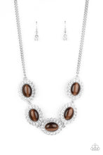 Load image into Gallery viewer, Dotted with glowing brown cat&#39;s eye stone centers, glassy white rhinestone encrusted frames glamorously link below the collar in a sparkly statement-making fashion. Features an adjustable clasp closure.
