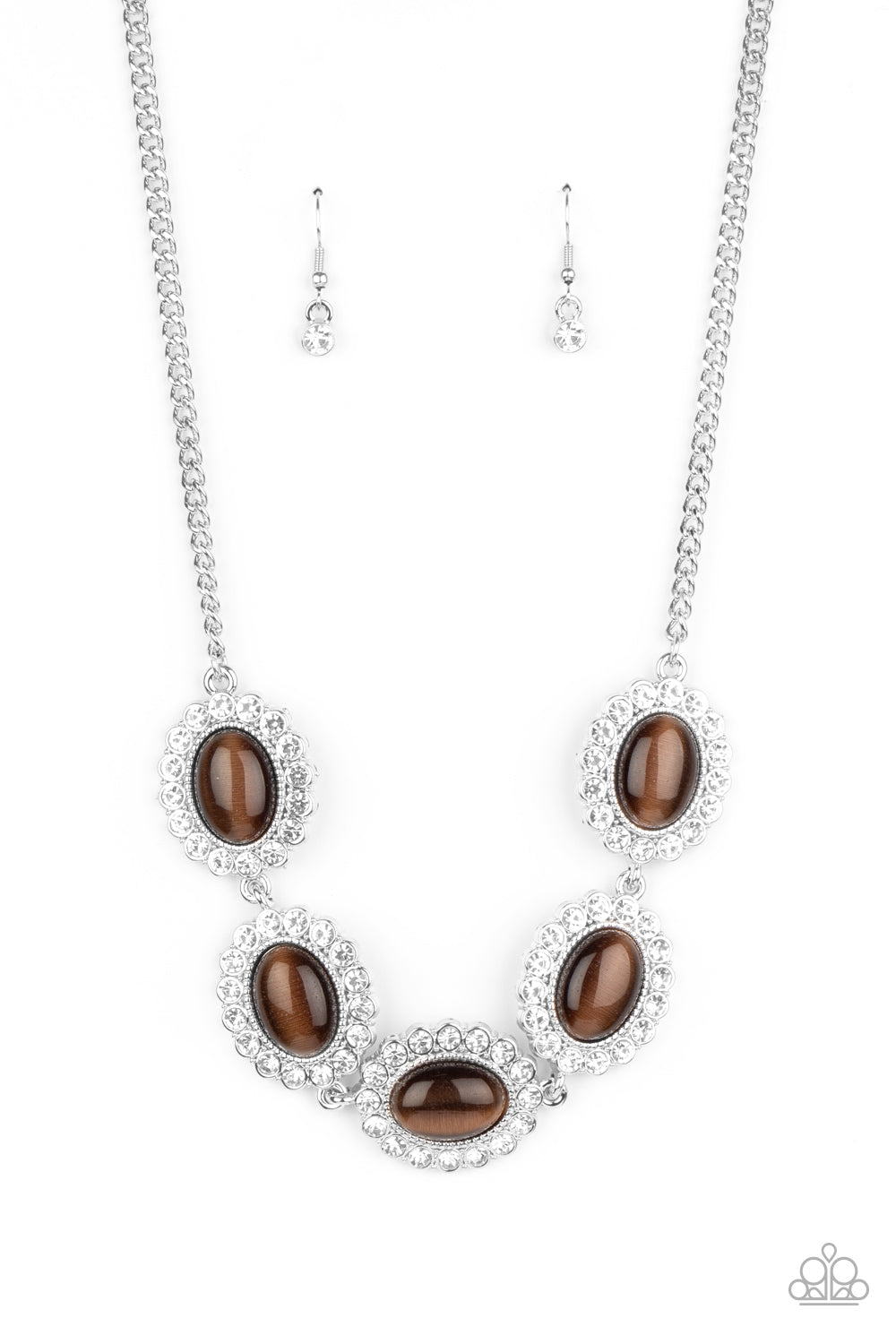 Dotted with glowing brown cat's eye stone centers, glassy white rhinestone encrusted frames glamorously link below the collar in a sparkly statement-making fashion. Features an adjustable clasp closure.