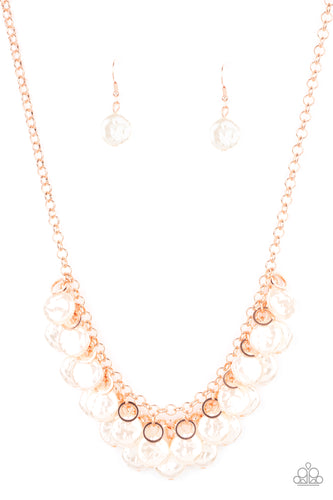 Featuring delicately hammered surfaces, rows of pearly white beads cascade from the bottoms of interlocking shiny copper chains. Dainty shiny copper rings swing from the top of the timelessly tiered display, creating a refined fringe below the collar. Features an adjustable clasp closure.  Sold as one individual necklace. Includes one pair of matching earrings.