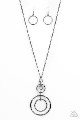 A series of shiny gunmetal hoops are threaded through glistening gunmetal fittings that connect into a dizzyingly stacked pendant at the end of a lengthened gunmetal chain. Features an adjustable clasp closure.