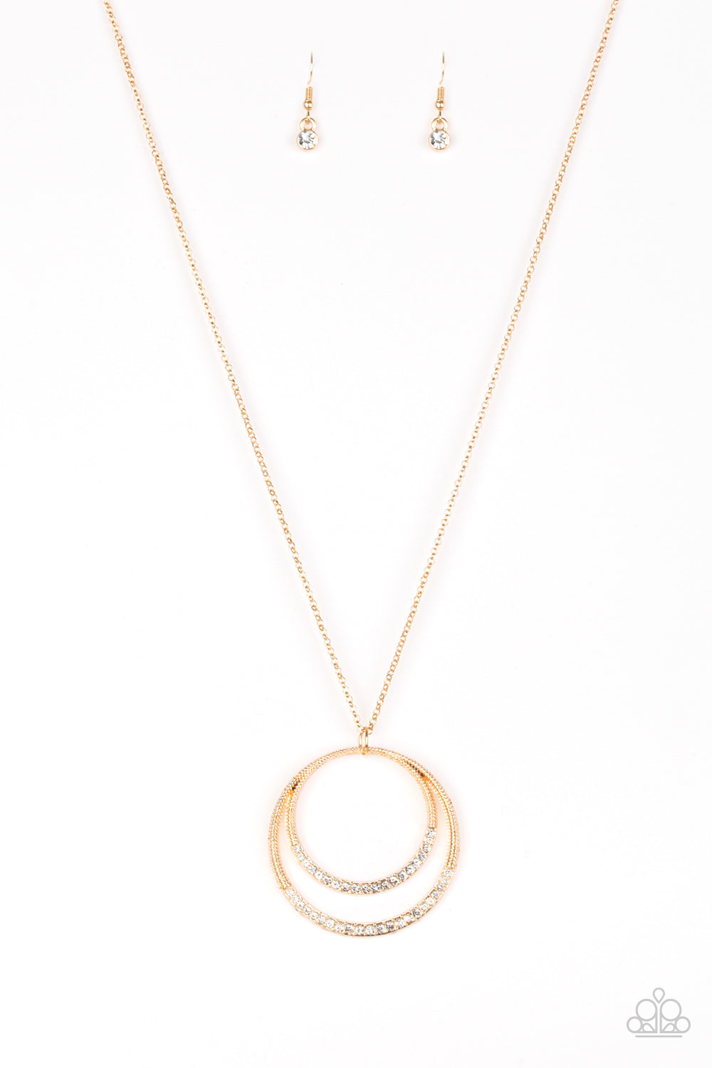 A daring circular pendant swings from the bottom of an elongated gold chain for a refined look. The bottoms of the ornate gold pendant are encrusted in white rhinestones for a glamorous finish. Features an adjustable clasp closure.