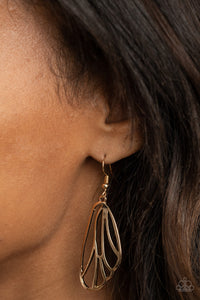 Glistening gold bars fan out into a pair of delicately scalloped wings, creating a whimsical display. Earring attaches to a standard fishhook fitting.  Sold as one pair of earrings.