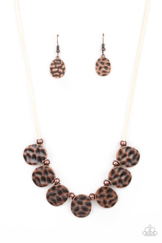 Hammered in a rustic finish, asymmetrical oval frames and antiqued copper beads alternate along a strip of white suede below the collar, creating a bold fringe. Features an adjustable clasp closure.  Sold as one individual necklace. Includes one pair of matching earrings.