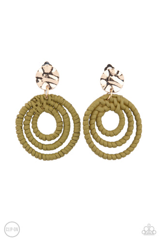 A hammered gold disc attaches to rippling hoops wrapped in green wicker-like cording, creating an earthy lure. Earring attaches to a standard clip-on fitting.  Sold as one pair of clip-on earrings.  New Kit Clip On Earring