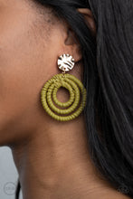 Load image into Gallery viewer, A hammered gold disc attaches to rippling hoops wrapped in green wicker-like cording, creating an earthy lure. Earring attaches to a standard clip-on fitting.  Sold as one pair of clip-on earrings.  New Kit Clip On Earring
