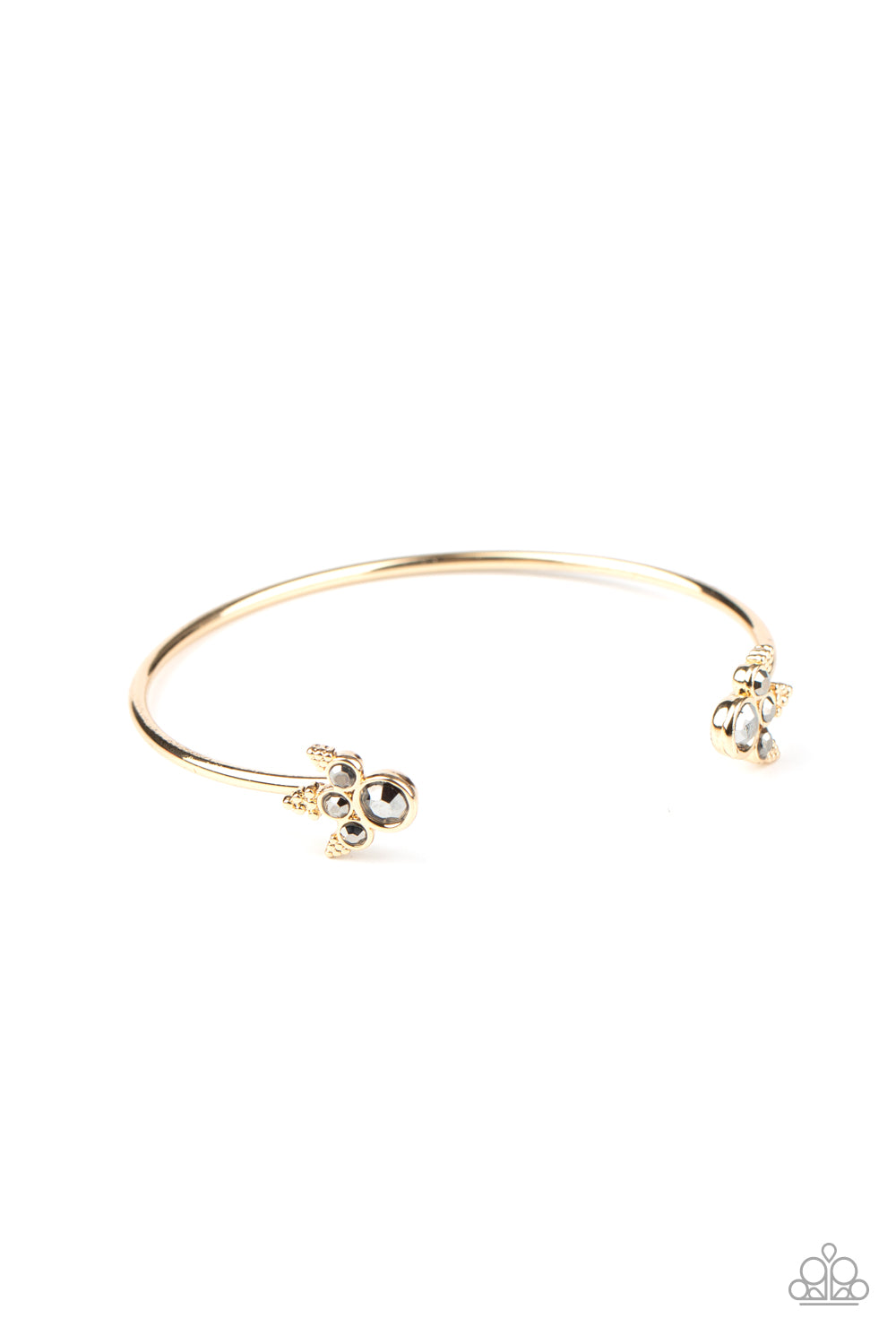 Featuring regal hematite rhinestone encrusted fittings, a dainty gold cuff curls around the wrist for a refined look.