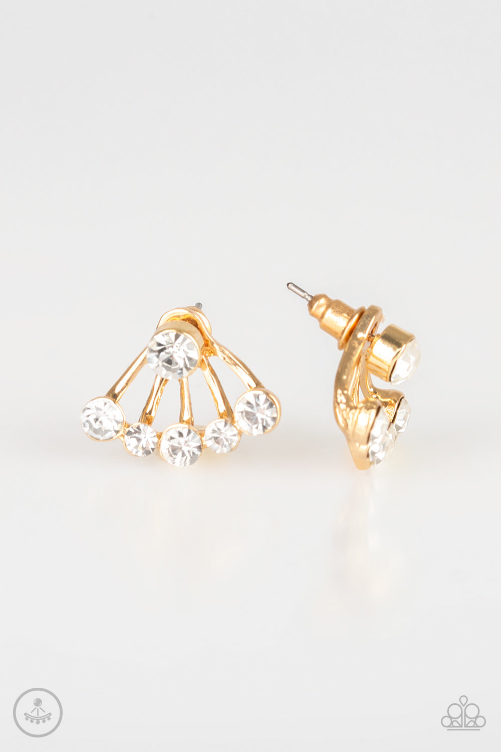 A solitaire white rhinestone attaches to a double-sided post, designed to fasten behind the ear. Radiating with a flared row of glassy white rhinestones, the double sided-post peeks out beneath the ear for an edgy look. Earring attaches to a standard post fitting.