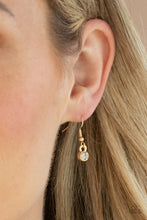 Load image into Gallery viewer, Featuring a dramatically oversized white teardrop rhinestone center, dainty white rhinestone encrusted gold frames connect with pairs of glassy marquise cut rhinestones below the collar for a sparkly statement-making look. Features an adjustable clasp closure.  Sold as one individual necklace. Includes one pair of matching earrings.
