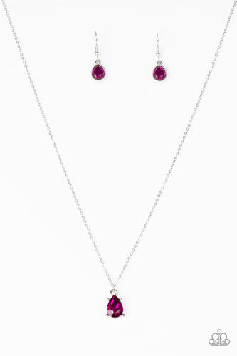 Featuring a regal teardrop cut, a radiant pink gem swings from the bottom of a dainty silver chain, creating a timeless pendant below the collar. Features an adjustable clasp closure.