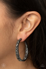 Load image into Gallery viewer, The front facing surface of a chunky gunmetal hoop is dipped in brilliantly sparkling hematite rhinestones while light-catching texture wraps around the back.  The interior of the hoop features the opposite pattern, creating the illusion of a full hoop of blinding shimmer.  Earring attaches to a standard post fitting.  Hoop measures 1 3/4&quot; in diameter
