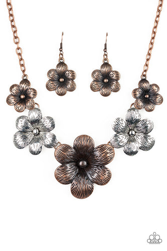 Brushed in an antiqued shimmer, lifelike copper and silver flowers gradually increase in size as they link below the collar in a seasonal fashion. Features an adjustable clasp closure.  Sold as one individual necklace. Includes one pair of matching earrings.