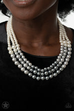 Load image into Gallery viewer, Strands of white, silver, and dark gray pearls elegantly drape below the collar, creating a beautiful ombre effect. Sectioned by silver accents, the luminescent pearls radiantly fall into a glamorous cascade. Features an adjustable clasp closure.
