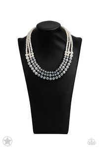 Strands of white, silver, and dark gray pearls elegantly drape below the collar, creating a beautiful ombre effect. Sectioned by silver accents, the luminescent pearls radiantly fall into a glamorous cascade. Features an adjustable clasp closure.