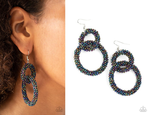 Luck BEAD a Lady - Multi Earrings. A dainty collection of iridescent oil spill seed beads adorns two interlocking hoops, creating a colorfully stacked lure. Earring attaches to a standard fishhook fitting.