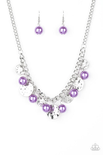 A collection of hammered silver discs and pearly purple beads swing from a thick silver chain, creating an elegant fringe below the collar. Features an adjustable clasp closure.